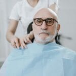 Senior at dental vision and hearing checkup