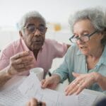 Senior reviewing Medicare appeal paperwork
