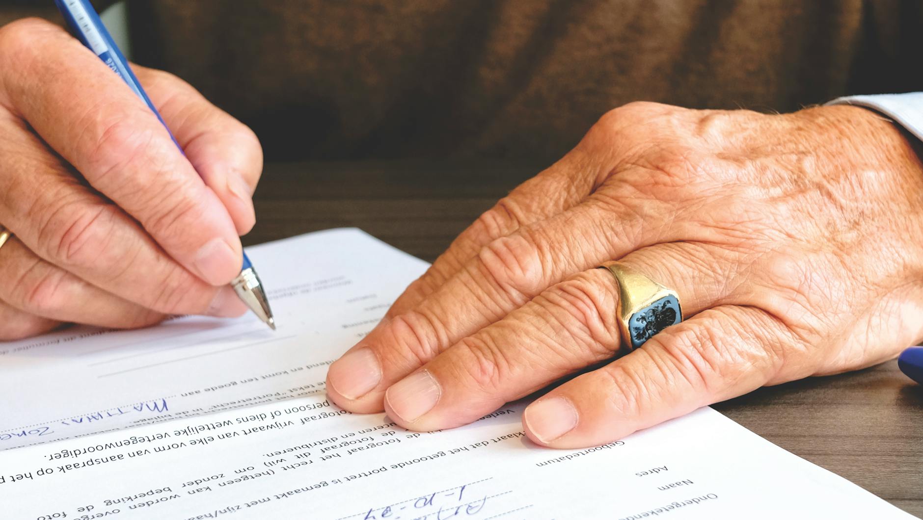 Senior reviewing Medicare claim denial documents
