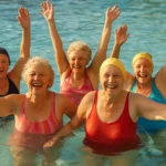 Senior women doing water aerobics aquatic exercise in pool 2026
