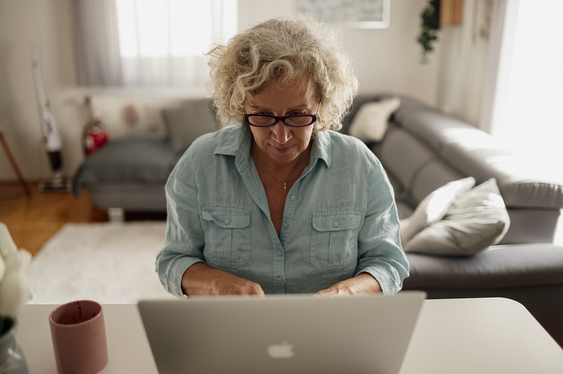 Senior woman working on a laptop at home