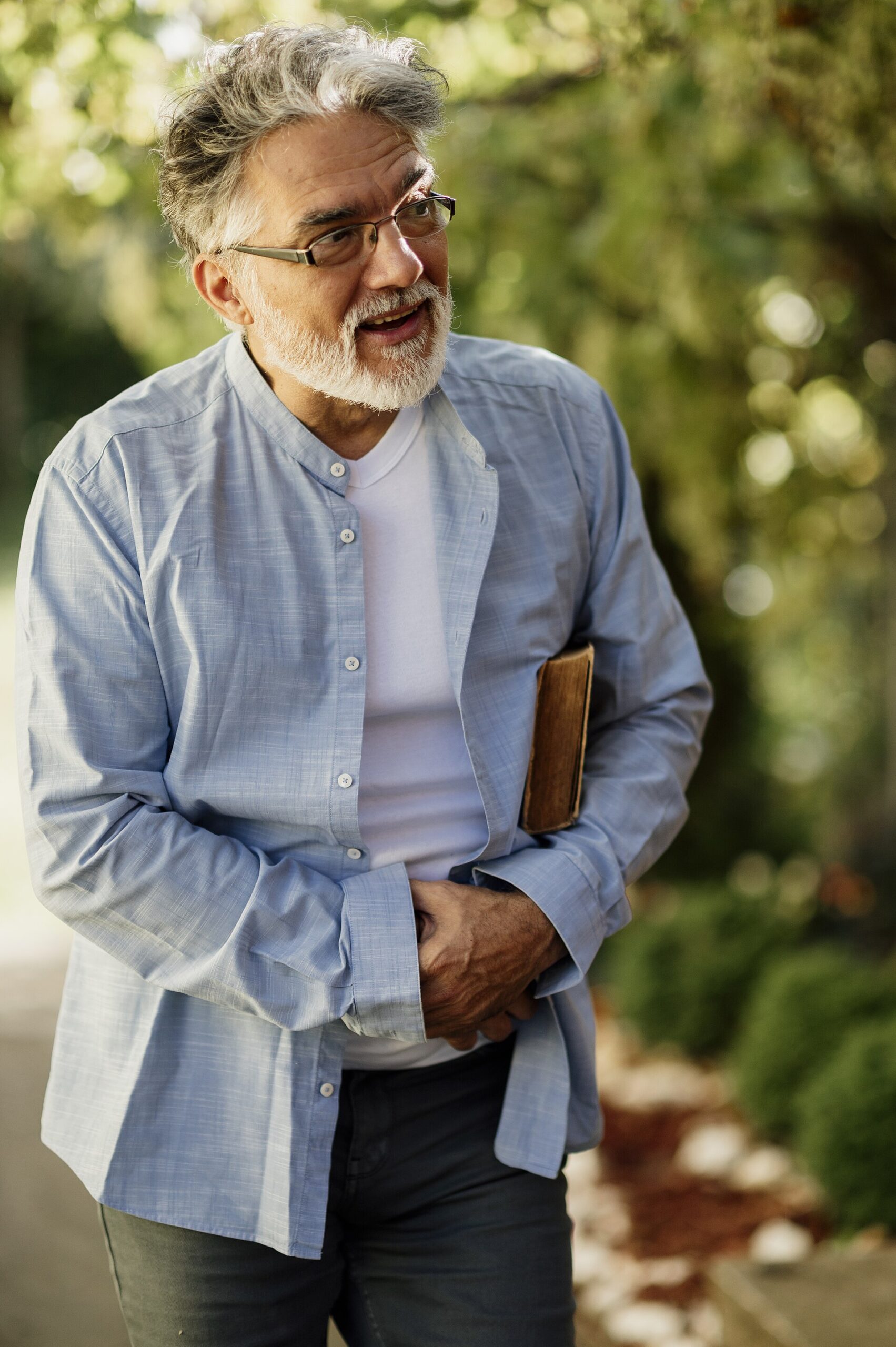 Older man walking in a park