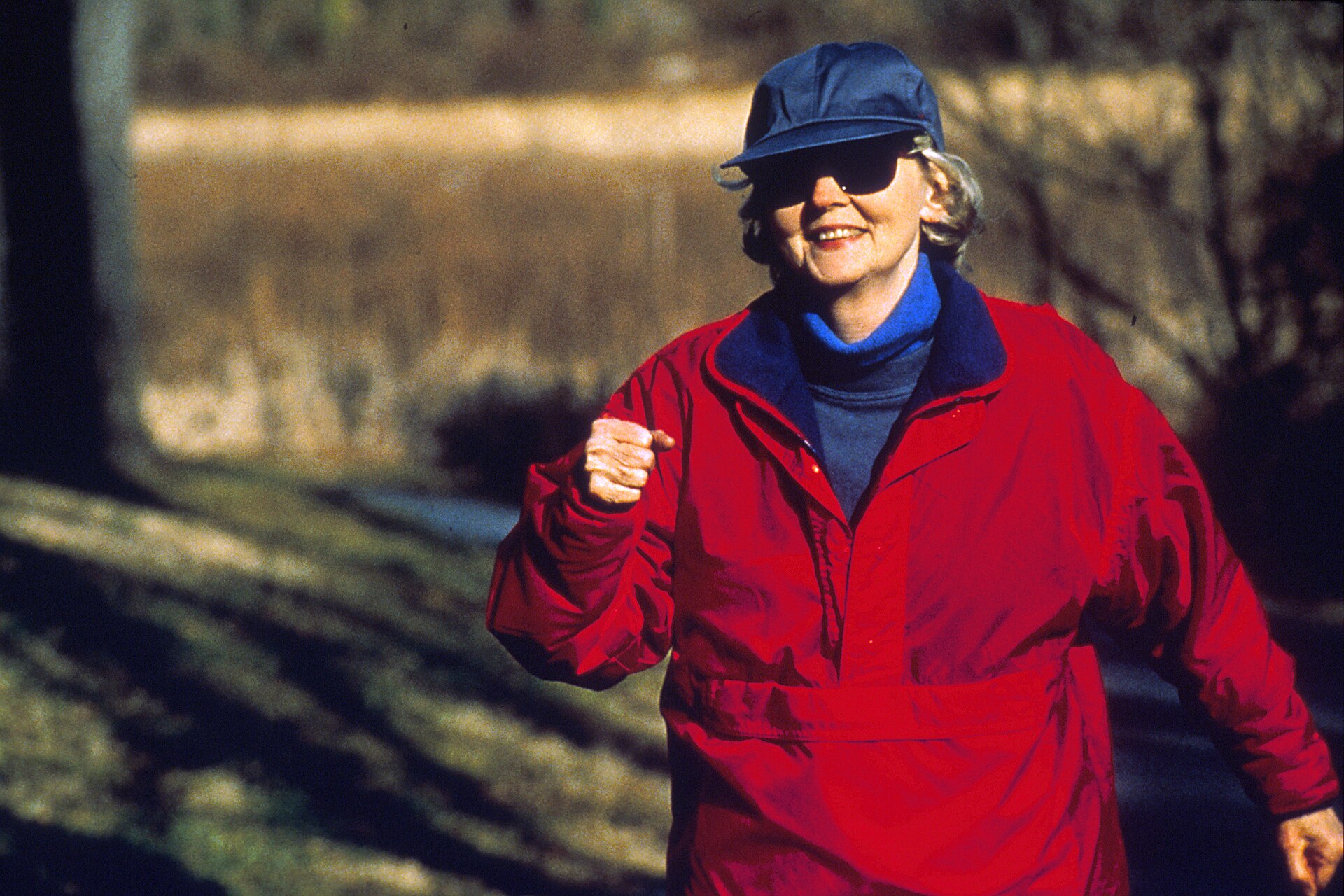 Older woman power walking outdoors