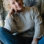 Smiling senior woman with curly hair, portrait
