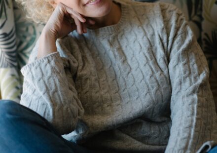 Smiling senior woman with curly hair, portrait