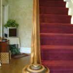 Wooden staircase with a sturdy handrail and banister in a home