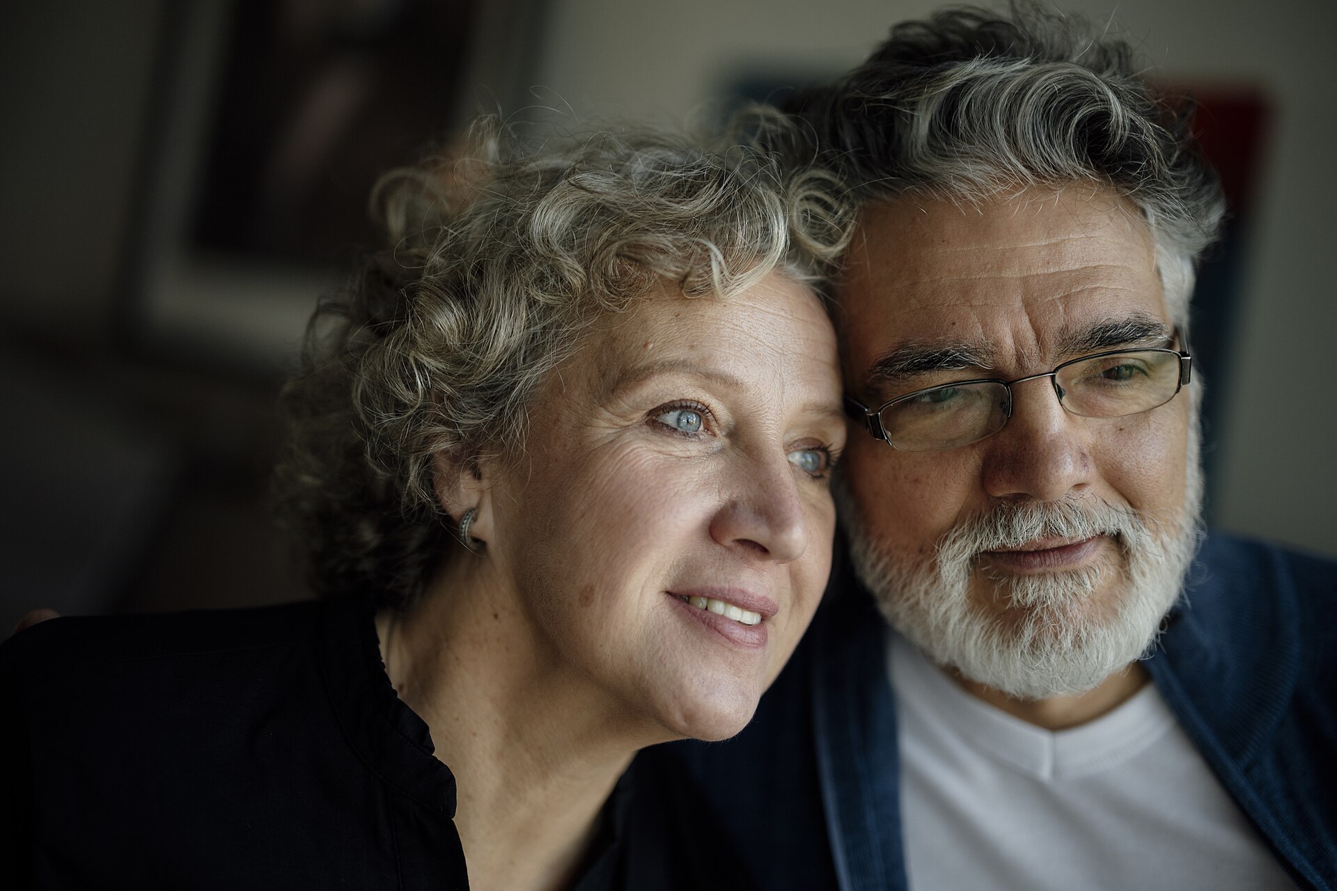 Older couple sitting together at home
