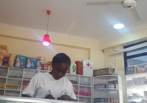 A pharmacist working at a pharmacy counter