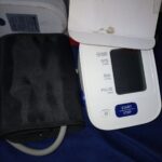 An automatic home blood pressure monitor with its arm cuff