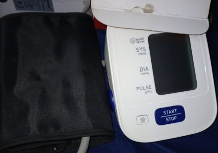 An automatic home blood pressure monitor with its arm cuff
