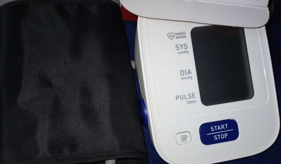 An automatic home blood pressure monitor with its arm cuff