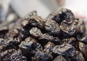 A close-up of a pile of dried prunes