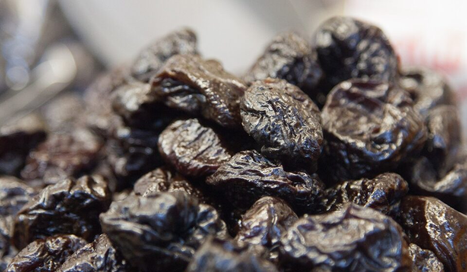 A close-up of a pile of dried prunes
