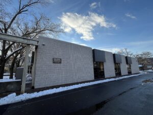 The Social Security Administration office building in downtown Corning, New York, on a winter day with snow along the sidewalk