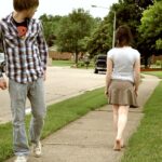 A pair of walking shoes on a sidewalk