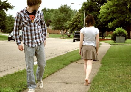 A pair of walking shoes on a sidewalk
