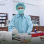 A pharmacist preparing medicines in a pharmacy