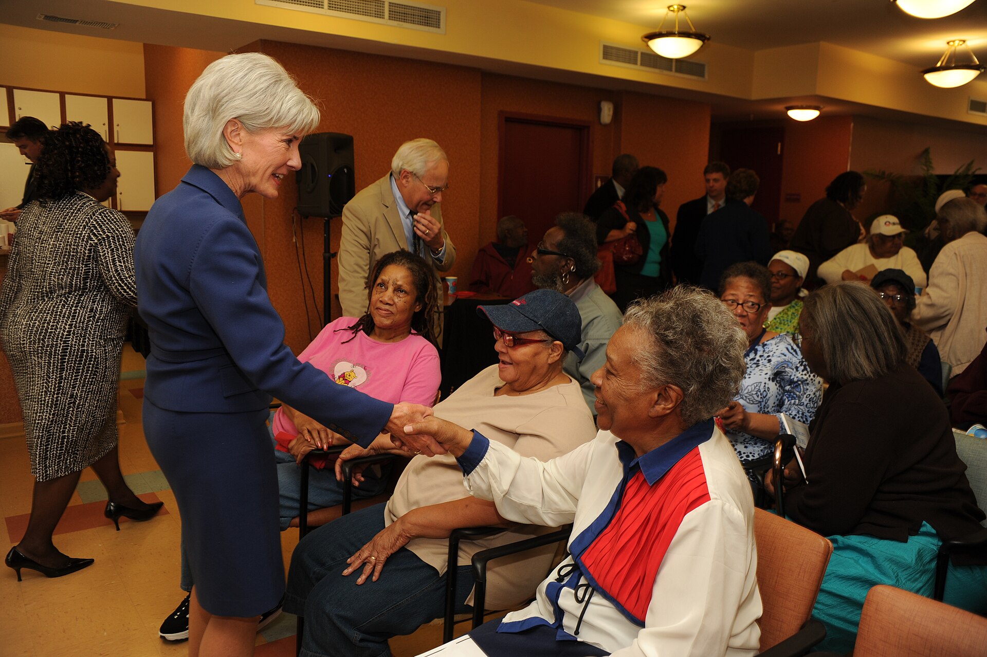Federal officials discussing Medicare open enrollment materials